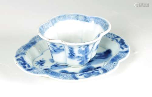 AN 18TH CENTURY CHINESE KANGXI BLUE AND WHITE SHAPED CUP AND...