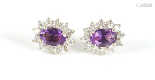 A PAIR OF LADIES 9CT GOLD AMETHYST AND DIAMOND EARINGS