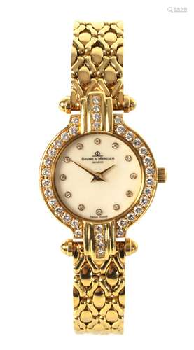 AN 18CT GOLD LADIES WRIST WATCH BY BAUME & MERCIER