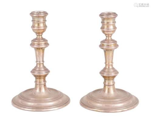 A PAIR OF EARLY GEORGIAN STYLE SILVER CANDLESTICKS