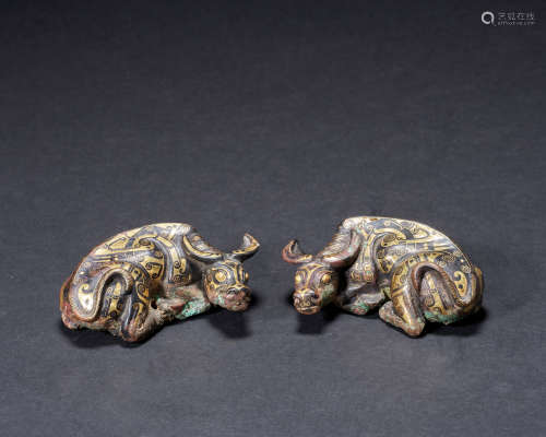 Ancient China a pair of oxen lying with gold