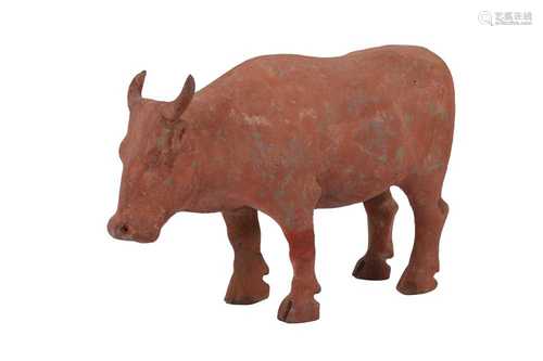 A CHINESE POTTERY MODEL OF A BULL, HAN