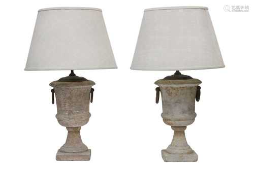 A PAIR OF PAINTED AND DISTRESSED TERRACOTTA TABLE LAMPS
