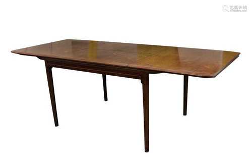 A WALNUT EXTENDING DINING TABLE