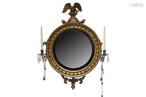 A REGENCY GILT CONVEX WALL MIRROR