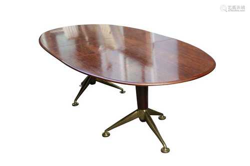 A ROSEWOOD TWIN PEDESTAL OVAL DINING TABLE