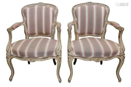 A PAIR OF LOUIS XVI STYLE PAINTED AND DISTRESSED BEECH FAUTE...