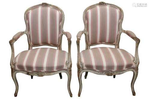 A PAIR OF LOUIS XVI STYLE PAINTED AND DISTRESSED BEECH FAUTE...