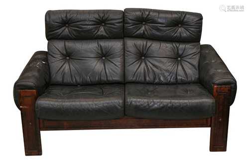 MANNER OF LEOLUX, A PAIR OF STAINED BEECH TWO SEATER SOFAS, ...