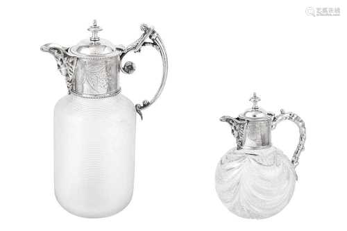 TWO SILVER MOUNTED GLASS CLARET JUGS