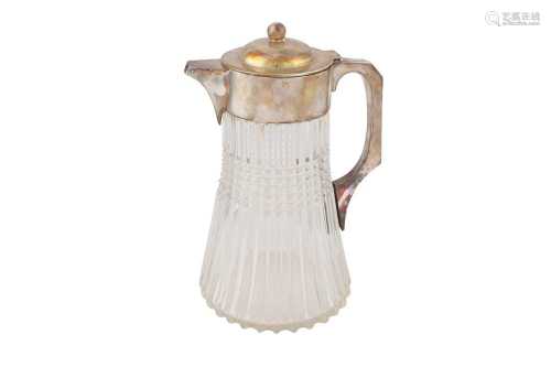 A LARGE GLASS AND SILVER PLATED WATER JUG, 20TH CENTURY