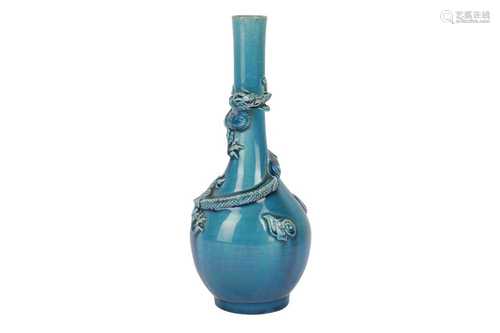 A JAPANESE TURQUOISE-GLAZED 'DRAGON' BOTTLE VASE.