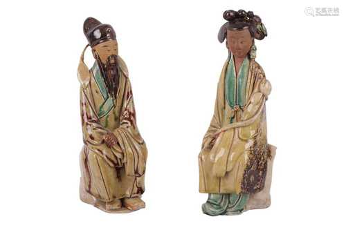 A PAIR OF CHINESE POTTERY FIGURES OF A GENTLEMAN AND LADY, 2...