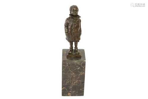 A DECORATIVE BRONZE FIGURE OF A BOY IN A COAT,