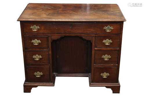 A GEORGIAN MAHOGANY KNEEHOLE DESK