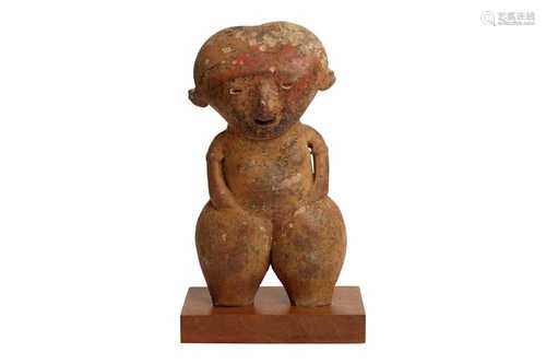 A POTTERY FIGURE OF A FEMALE, POSSIBLY PRE-COLUMBIAN