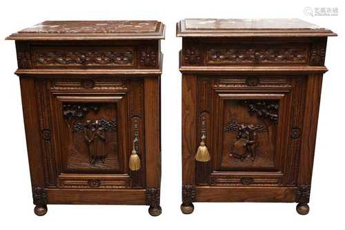 A PAIR OF CONTINENTAL CARVED ELM BEDSIDE CABINETS