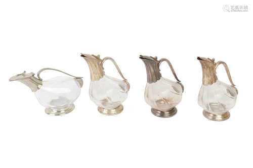 A SET OF THREE ZWIESEL SILVER PLATED AND GLASS DECANTERS