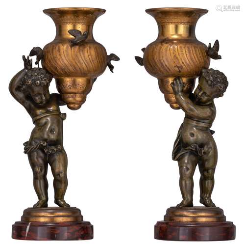 A pair of bronze putti carrying an urn-shaped vase, H 25 - 2...