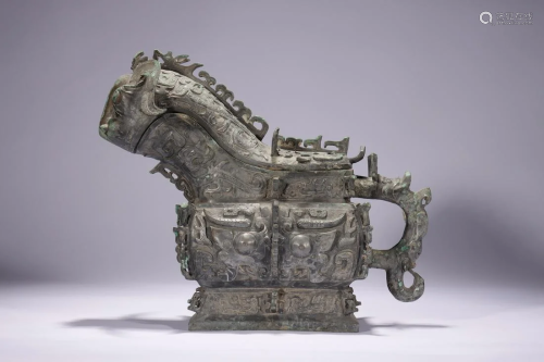 CHINESE ANCIENT BRONZE BEAST HANDLED WINE CONTAINER