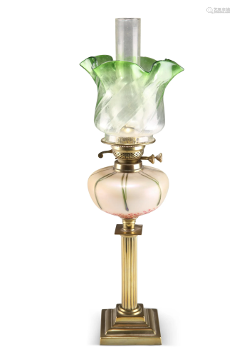 AN EDWARDIAN BRASS COLUMNAR OIL LAMP, the matte glass