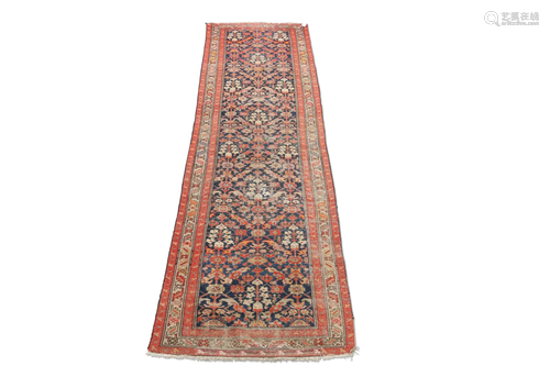 A MALAYER RUNNER, CIRCA 1930, the dark blue field with