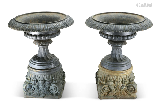 A LARGE AND IMPRESSIVE PAIR OF CAST IRON URNS, of