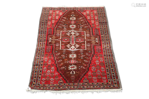 AN AFGHAN RUG, the brick red field with large stepped