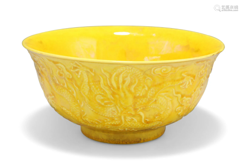 A CHINESE YELLOW-GLAZED BOWL, flared circular, moulded