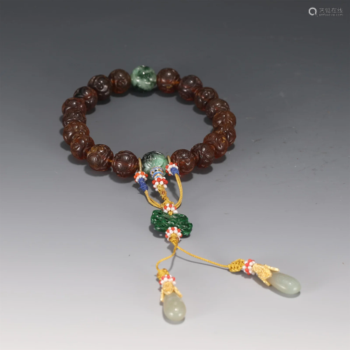 A CARVED PEKING GLASS PRAYER BEADS