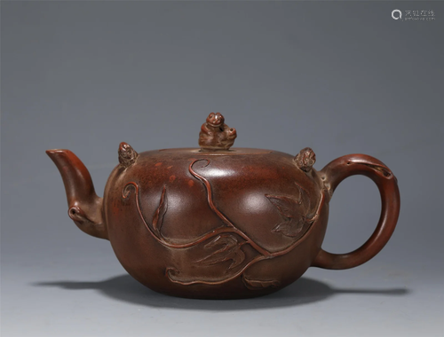 A YIXING GLAZED TEAPOT