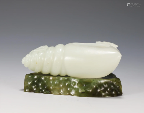 A CARVED WHITE JADE CONCH WASHER