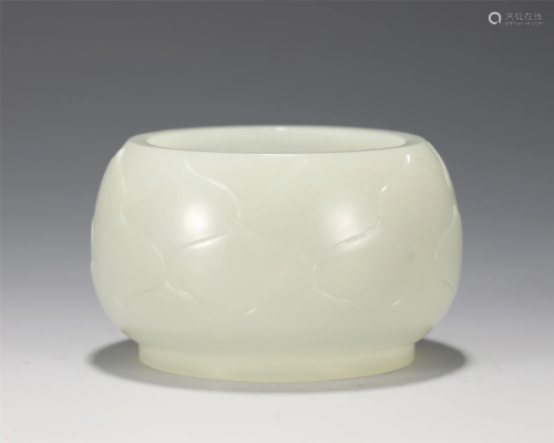 A CARVED WHITE JADE WASHER