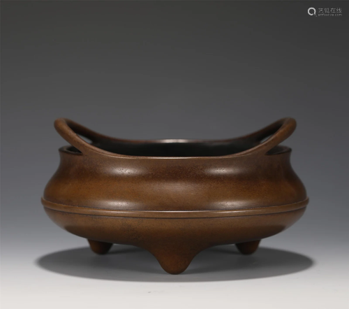 A BRONZE TRIPOD CENSER