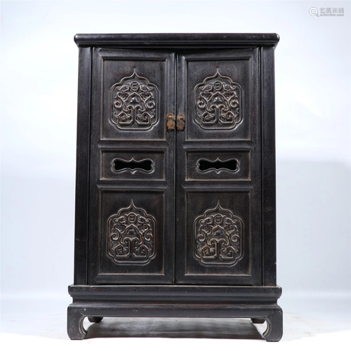 A CARVED ROSEWOOD CABINET