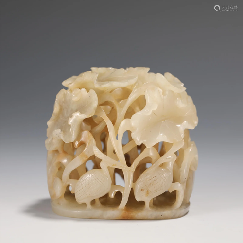 A CARVED WHITE JADE FINIAL