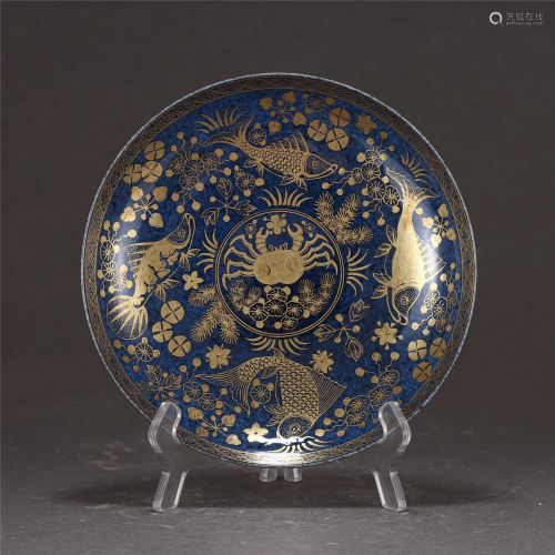 A BLUE SPLASHED GROUND AND GILT FISHES PLATE