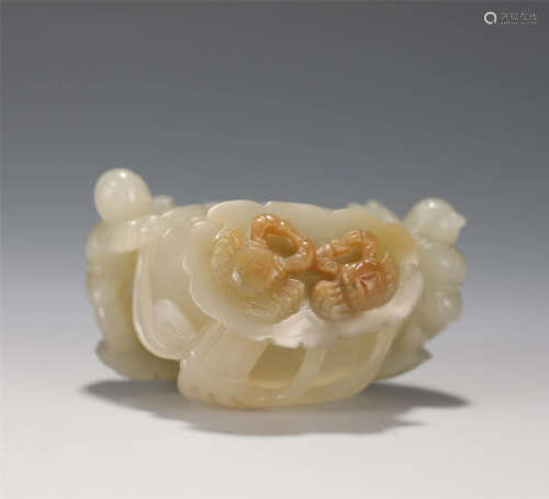 A CARVED JADE FIGURAL CUP