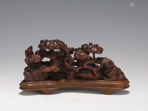 A CARVED HARDWOOD LINGZHI BRUSHREST