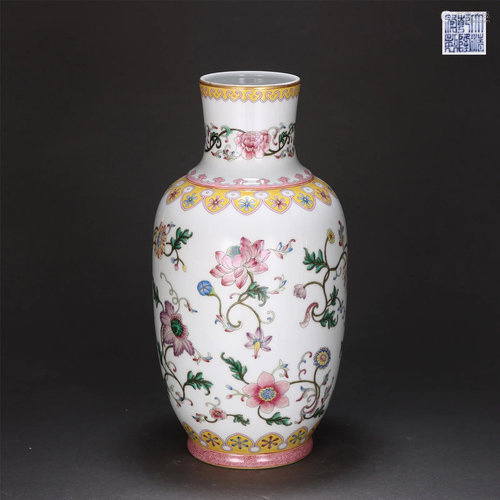 A FAMILLE ROSE FLORAL SCROLLS VASE