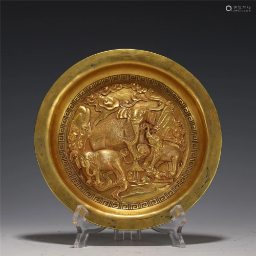 A MOLDED GOLD ELEPHANT PLATE