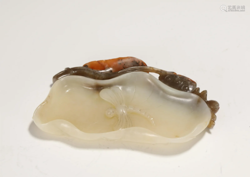 A CARVED WHITE AND RUSSET JADE WASHER