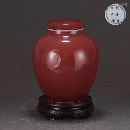 A COPPER RED TEA CADDY WITH COVER