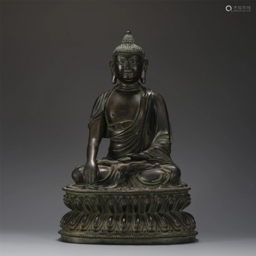 A BRONZE SEATED SHAKYAMUNI