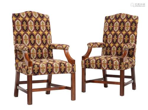 A pair of mahogany and tapestry upholstered open armchairs i...