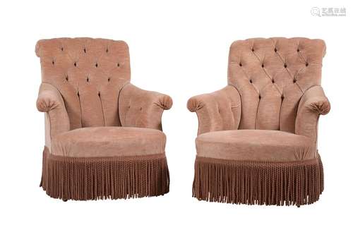 A pair of pink upholstered armchairs in late 19th century st...