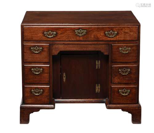 A George II 'red walnut' kneehole desk