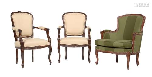 A pair of stained beech armchairs