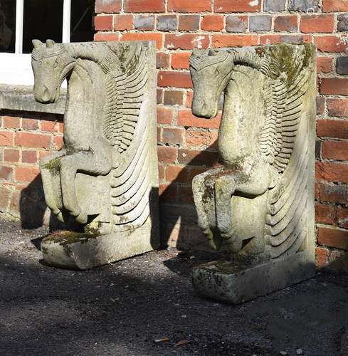 A pair of carved stone table ends