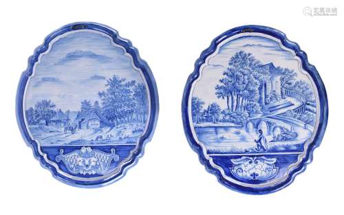 Two similar Dutch Delft blue and white shaped oval wall-plaq...